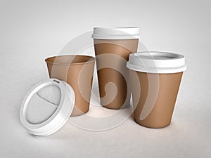 Three different size paper cups for coffee with plastic caps on