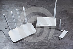 Three different types of Wi-Fi routers, modern and old technology. Wireless ethernet connection signal