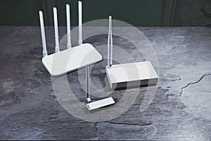 Three different types of Wi-Fi routers, modern and old technology. Wireless ethernet connection signal