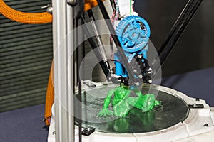 Three dimensional 3d printer machine working plastic toy model at factory