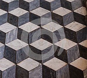 The three-dimensional effect f a marble cube floor in a church