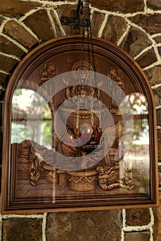 Three-dimensional icon on a Christian theme carved from wood photo