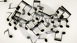 Three-dimensional notes are scattered on a white background. musical concept. 3d render