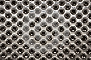 Three-dimensional texture of chrome with perforation