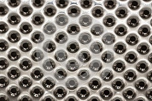 Three-dimensional texture of chrome with perforation