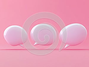 Three dimensional white speech bubbles against a pastel pink background
