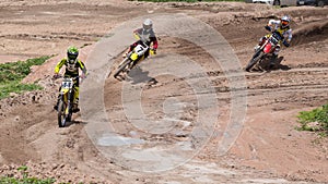 Three Dirt Bikes Battle a Corner