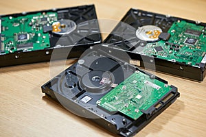 Three disassembled SATA hard disk drives