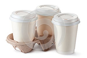 Three disposable coffee cups with plastic lid photo