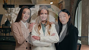 Three diversity business women girls multiracial female multiethnic businesswomen Asian Korean Caucasian colleagues co