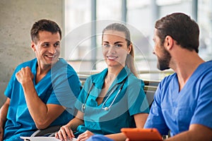 Three doctors having an changeover and feeling good photo