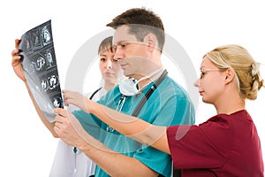 Three doctors with x-ray tomogram photo