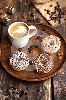 Three donuts and a Cup of coffee