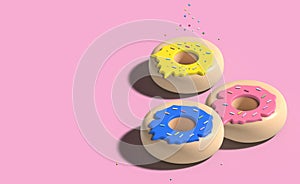 Three donuts with icing and colorful sugar sprinkles on a pink background