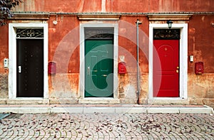 Three doors and three mailboxes photo