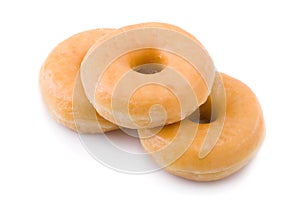Three doughnuts or donuts piled photo