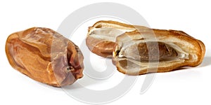 Three dried dates in close up on white background. Front view . Full depth of field