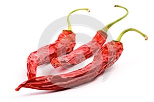 Three dry red chilly peppers