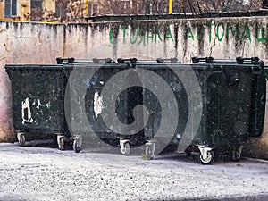 Three dust trash bin in winter snow