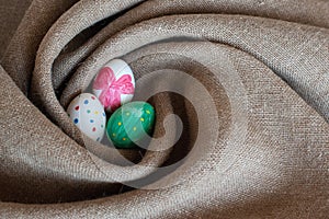 Three Easter eggs in a nest