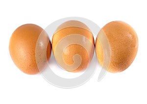 Three eggs are isolated on a white background