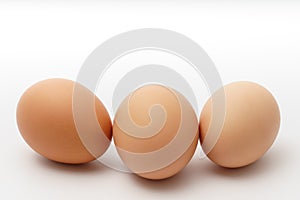 Three eggs on a white background