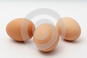 Three eggs on a white background