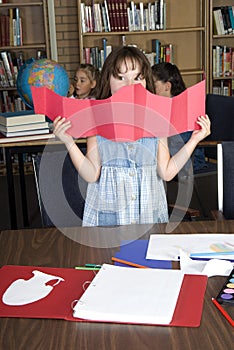 Three Elementary school students studying photo