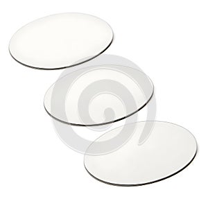 Three ellipse-shaped blank stickers isolated on white background photo