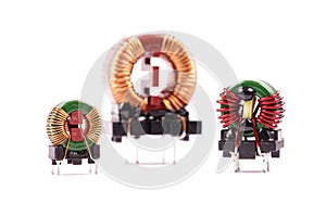 Three EMC chokes isolated on white