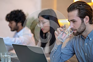 Three employees working together in the company office