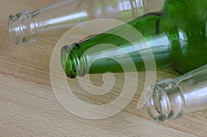 Three empty beer bottles lie on the table photo