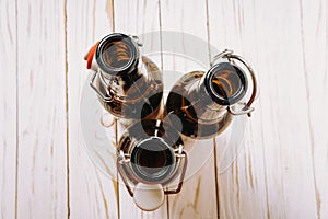 Three empty Brown bottles with lids