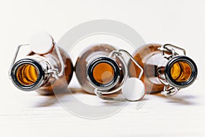 Three empty Brown bottles with lids