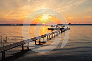 Three empty chairs on wooden jetty on lake