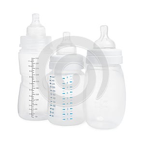 Three empty feeding bottles for baby milk on white background