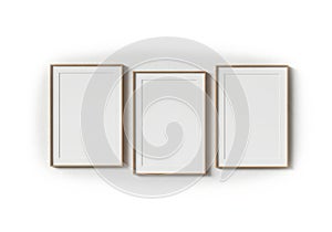 Three empty picture frames on wall