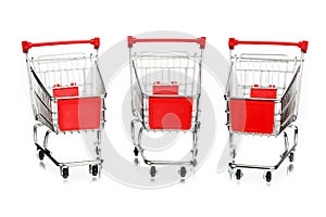 Three empty shopping carts