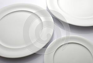 Three Empty white plates