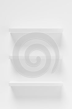 Three empty white shelfs or boards on white wall, object or product presentation template