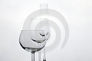 Three empty wineglasses diffrent shape on whete background with copy space
