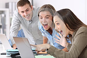 Three excited employees receiving good news