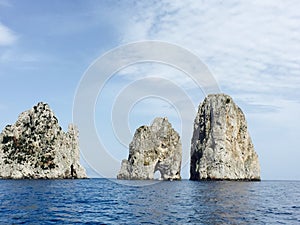 Three famous Faraglioni off the waters of Capri