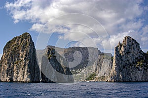 Three Faraglioni rock formations off the coastline of the island of Capri, Italy.