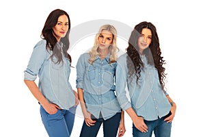 Three fashion models in blues jeans clothes