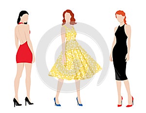 Three fashionable women wearing different fashionable dresses isolated on white background