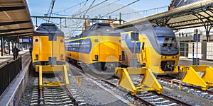 Three Fast Intercity Commuter Trains waiting at a station