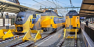 Three Fast Intercity Commuter Trains waiting at a station