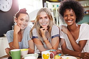 Three Female Friends Enjoying Breakfast At Home Together