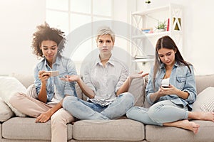 Three female friends at home